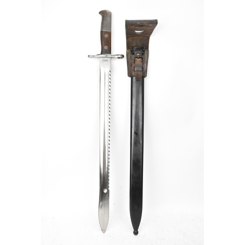 184 - A Swiss 1914 sawback bayonet, by Elsener Schwyz, length of blade 48cm, complete with steel scabbard ... 