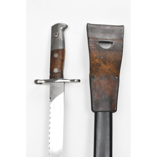 184 - A Swiss 1914 sawback bayonet, by Elsener Schwyz, length of blade 48cm, complete with steel scabbard ... 