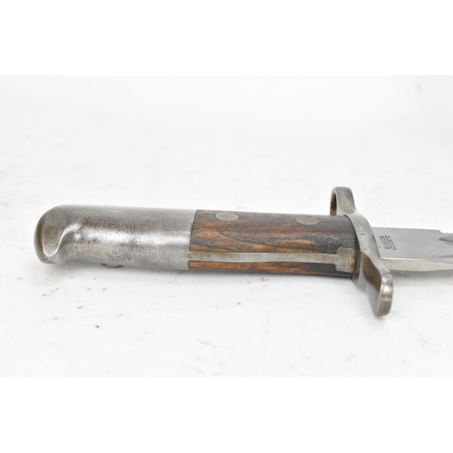 184 - A Swiss 1914 sawback bayonet, by Elsener Schwyz, length of blade 48cm, complete with steel scabbard ... 