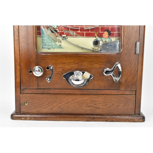 19 - An early/mid 20th century Chad penny oak cased penny slot machine, instructions to the bottom left, ... 