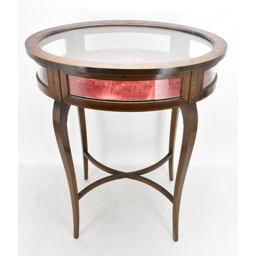 195 - An Edwardian mahogany and marquetry inlaid vitrine display table, of oval form, boxwood inlaid with ... 