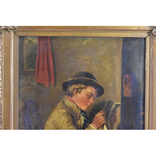 202 - A 19th century oil on canvas depicting an interior scene of a seated boy reading, inscribed to the r... 