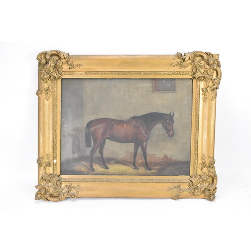 205 - A mid 19th century oil on canvas study of a horse in a stable, indistinctly signed to the lower left... 