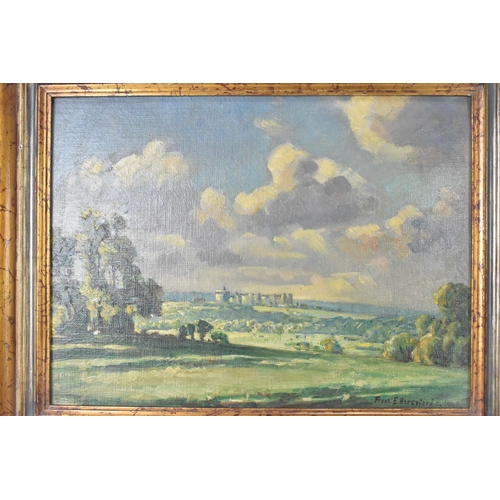 211 - Frank Ernest Beresford (1881-1967) - An oil on board depicting a landscape scene with Windsor castle... 