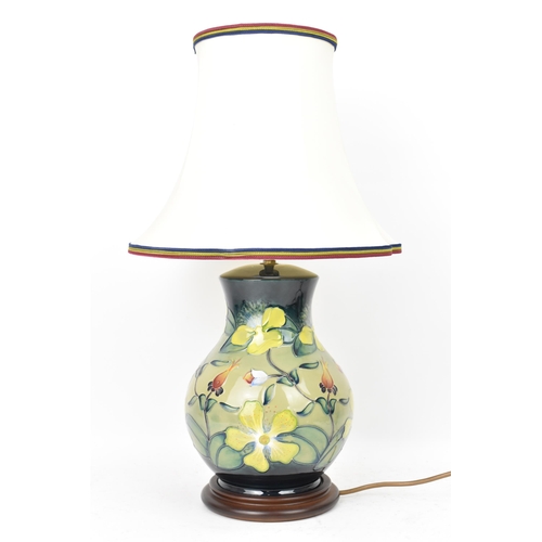 22 - A Moorcroft pottery 'Hypericum' pattern table lamp, designed by Rachel Bishop, of baluster form and ... 