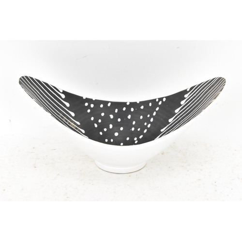 220 - A mid 20th century Norwegian Larholm bowl, with white slip decoration on a black ground, signed to t... 