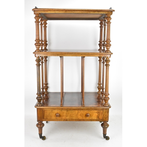 226 - A Victorian figured burr walnut three tier whatnot, having a gilt metal gallery top above three tier... 