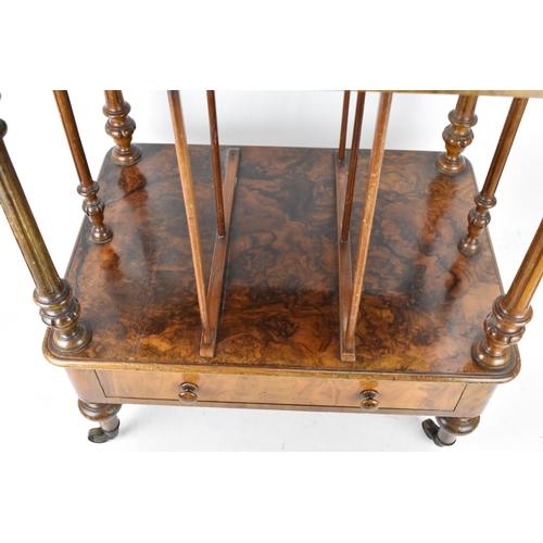 226 - A Victorian figured burr walnut three tier whatnot, having a gilt metal gallery top above three tier... 