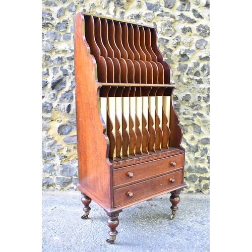 227 - A Victorian mahogany waterfall music sheet cabinet, having two open tiers with eleven fitted section... 