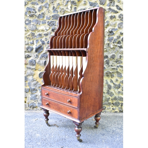 227 - A Victorian mahogany waterfall music sheet cabinet, having two open tiers with eleven fitted section... 