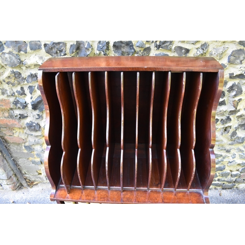 227 - A Victorian mahogany waterfall music sheet cabinet, having two open tiers with eleven fitted section... 