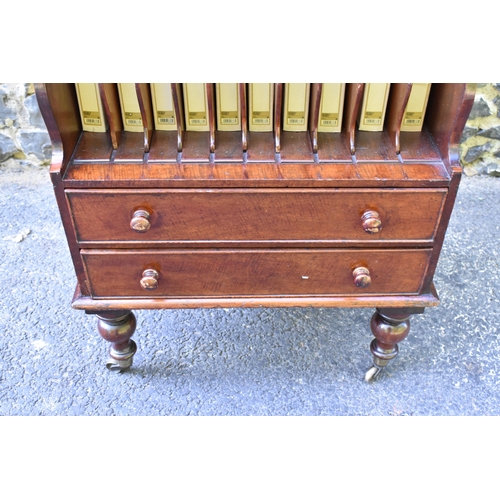 227 - A Victorian mahogany waterfall music sheet cabinet, having two open tiers with eleven fitted section... 