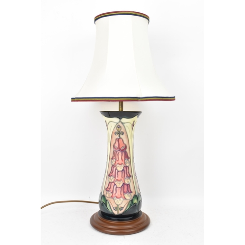 23 - A Moorcroft pottery 'Foxglove' pattern table lamp, designed by Rachel Bishop, of ovoid form tube lin... 