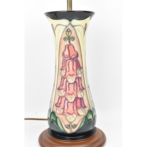 23 - A Moorcroft pottery 'Foxglove' pattern table lamp, designed by Rachel Bishop, of ovoid form tube lin... 