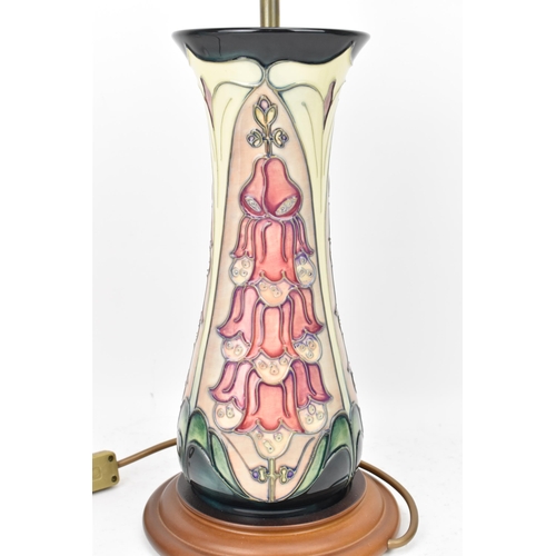 23 - A Moorcroft pottery 'Foxglove' pattern table lamp, designed by Rachel Bishop, of ovoid form tube lin... 