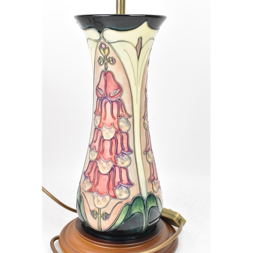 23 - A Moorcroft pottery 'Foxglove' pattern table lamp, designed by Rachel Bishop, of ovoid form tube lin... 