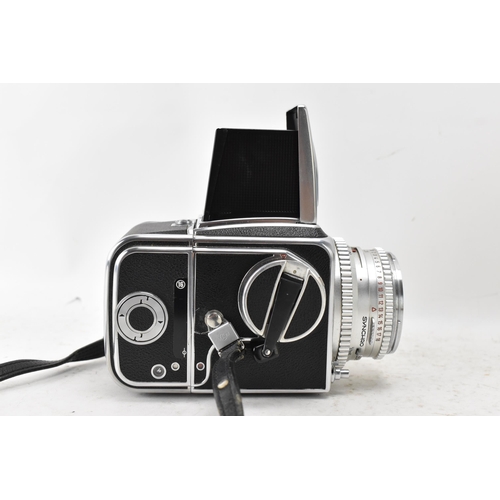 237 - A Hasselblad 500C chrome and black leatherette cased camera, with a Carl Zeiss Synchro Compur 80mm f... 