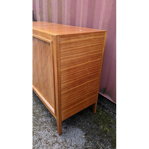 245 - A Gordon Russell 1950s double helix sideboard designed by David Booth and Judith Ledeboer having two... 