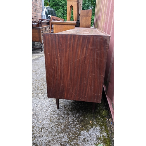 249 - Richard Hornby for Fyne Ladye - A mid 20th century afromosia teak sideboard, having a straight top w... 