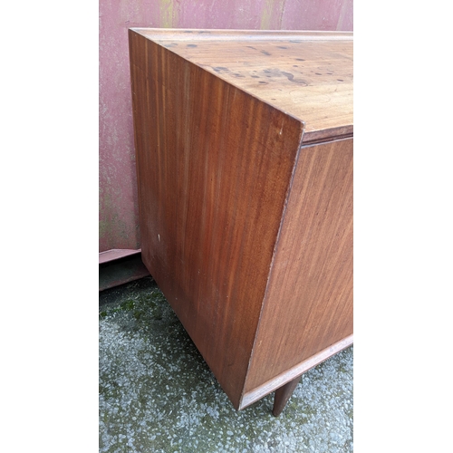 249 - Richard Hornby for Fyne Ladye - A mid 20th century afromosia teak sideboard, having a straight top w... 