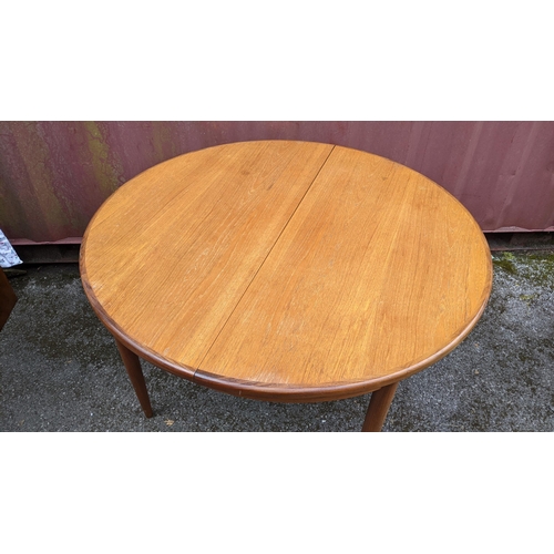 251 - Victor B Wilkins for G Plan - A retro 1960s teak 'Fresco' range extending dining table, of circular ... 