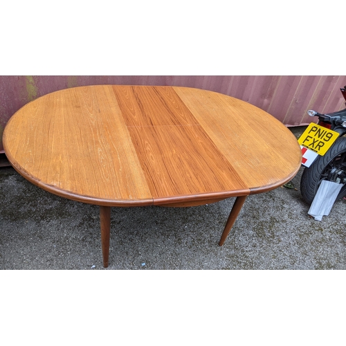 251 - Victor B Wilkins for G Plan - A retro 1960s teak 'Fresco' range extending dining table, of circular ... 