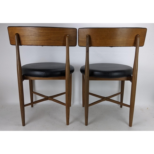 252 - Victor B Wilkins for G Plan - A set of four 1960s 'Fresco' range teak dining chairs having black lea... 