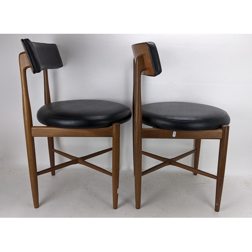 252 - Victor B Wilkins for G Plan - A set of four 1960s 'Fresco' range teak dining chairs having black lea... 