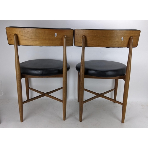 252 - Victor B Wilkins for G Plan - A set of four 1960s 'Fresco' range teak dining chairs having black lea... 