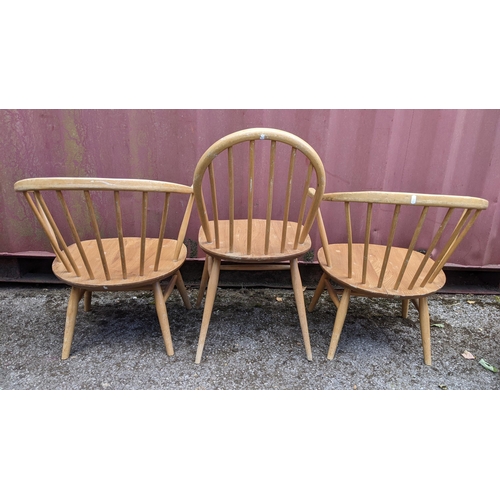 258 - Three mid 20th century Ercol light elm and beech chairs to include a single hoop back dining chair a... 