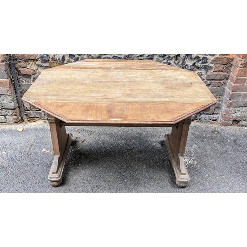 259 - A 1930s Heals style limed oak extending dining table, having an octagonal top with two fall flaps hi... 