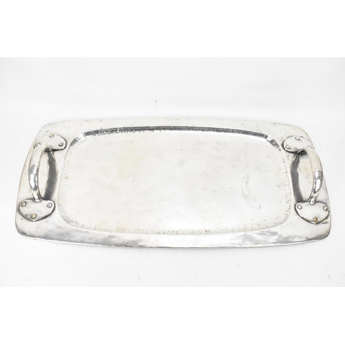 26 - An Arts & Crafts silver plated twin handled tray, possibly by liberty, of rectangular form, the rais... 