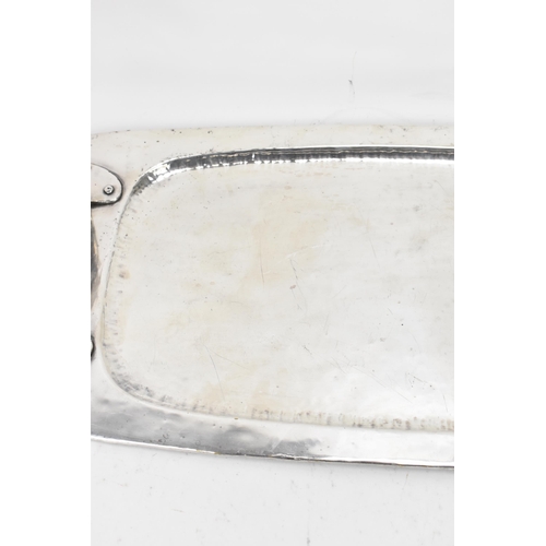 26 - An Arts & Crafts silver plated twin handled tray, possibly by liberty, of rectangular form, the rais... 