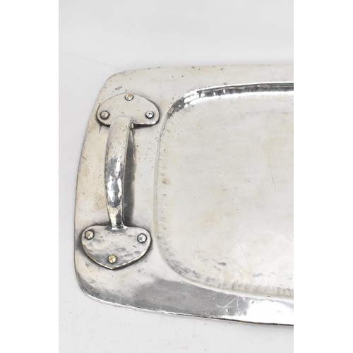 26 - An Arts & Crafts silver plated twin handled tray, possibly by liberty, of rectangular form, the rais... 