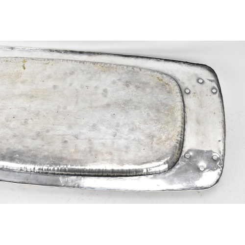 26 - An Arts & Crafts silver plated twin handled tray, possibly by liberty, of rectangular form, the rais... 