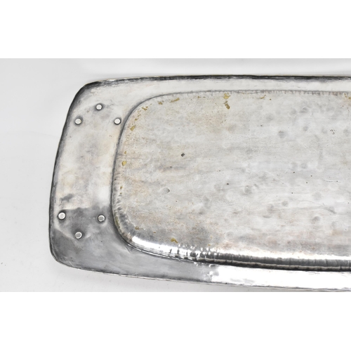 26 - An Arts & Crafts silver plated twin handled tray, possibly by liberty, of rectangular form, the rais... 