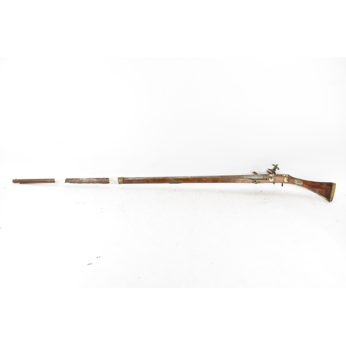 261 - A 19th century Middle Eastern flintlock action Jezail rifle, the barrel engraved with scroll design,... 