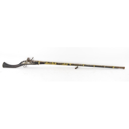 263 - A 19th century Middle Eastern flintlock action Jezail rifle, the barrel engraved with scroll design,... 