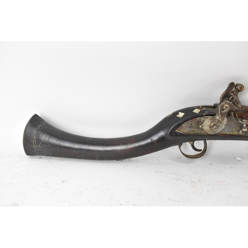 263 - A 19th century Middle Eastern flintlock action Jezail rifle, the barrel engraved with scroll design,... 