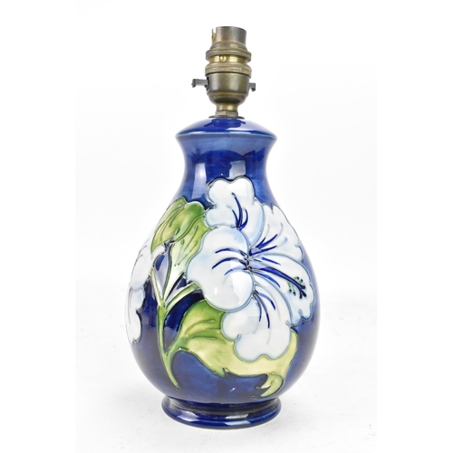 266 - A Moorcroft pottery 'Hibiscus' pattern table lamp, of baluster form, tube lined decorated with flowe... 