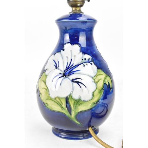 266 - A Moorcroft pottery 'Hibiscus' pattern table lamp, of baluster form, tube lined decorated with flowe... 