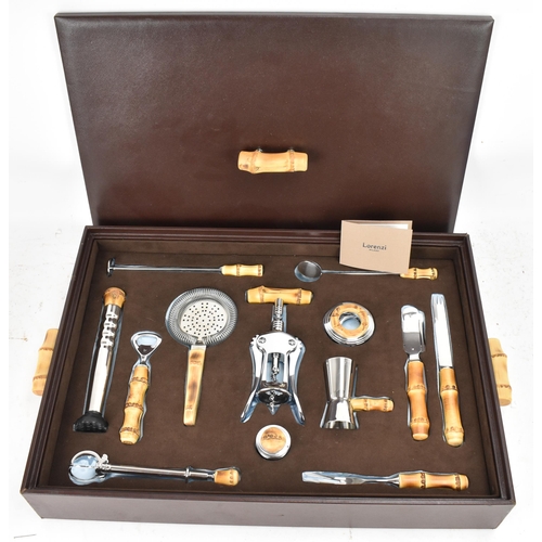 269 - A Lorenzi Milano Italian brown leather cased bar set, comprising a double lever corkscrew, cap lifte... 