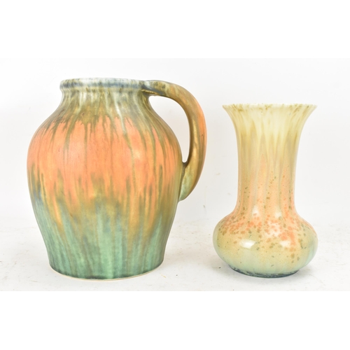 270 - Ruskin 1930s, a studio pottery jug and trumpet vase, each with multi-coloured trailing glazes, impre... 