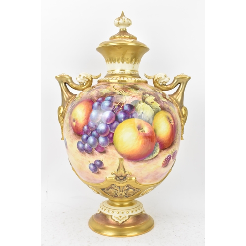 36 - A Royal Worcester porcelain twin handled pedestal vase and cover of baluster form, shape no. 1691, p... 