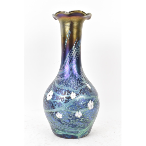 37 - An Okra glass vase, of baluster bottle neck form with iridescent lustre, decorated with trails and w... 