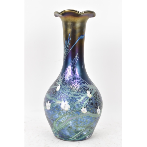 37 - An Okra glass vase, of baluster bottle neck form with iridescent lustre, decorated with trails and w... 