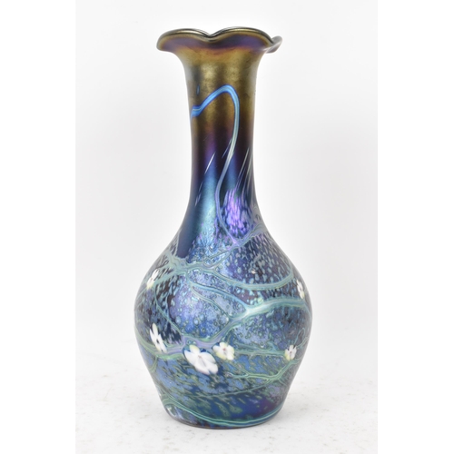 37 - An Okra glass vase, of baluster bottle neck form with iridescent lustre, decorated with trails and w... 