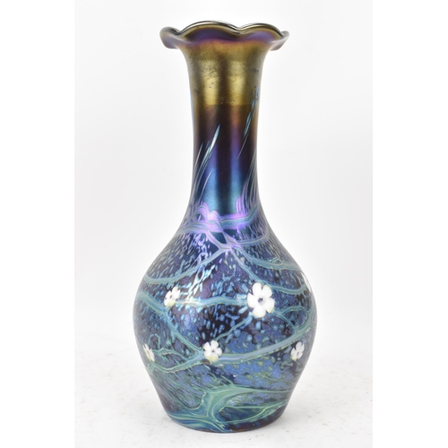 37 - An Okra glass vase, of baluster bottle neck form with iridescent lustre, decorated with trails and w... 