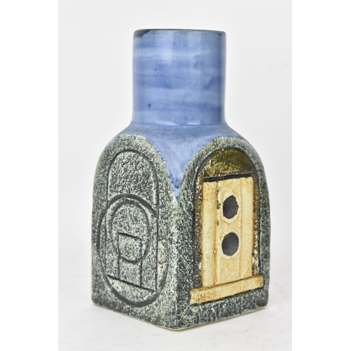 44 - A Troika pottery spice jar by Tina Doubleday, the four sides with incised geometric designs on a blu... 