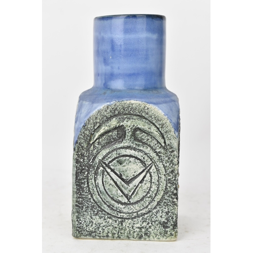 44 - A Troika pottery spice jar by Tina Doubleday, the four sides with incised geometric designs on a blu... 